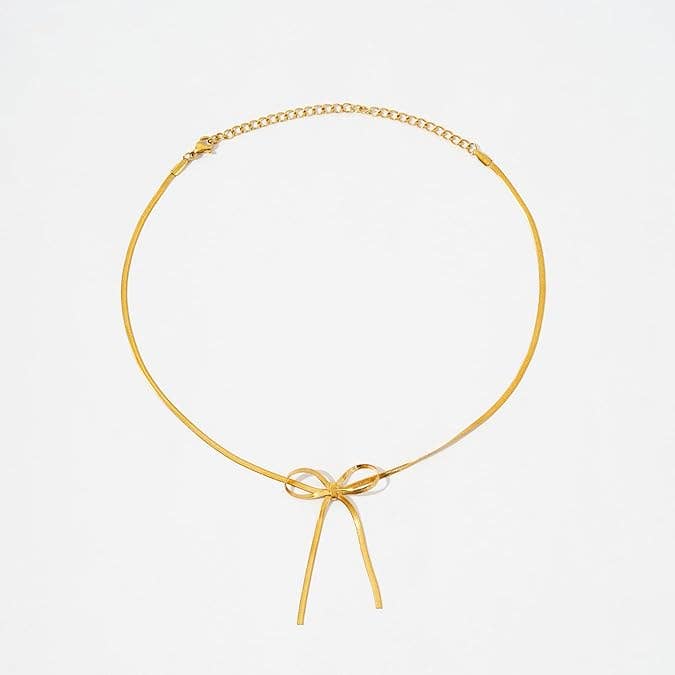 Delicate Steel Necklace with Central Bow Charm – Elegant